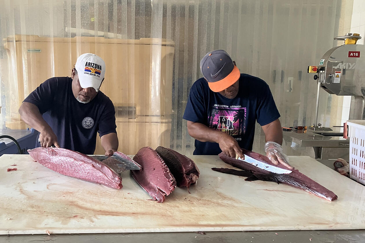 Locals filleting fish