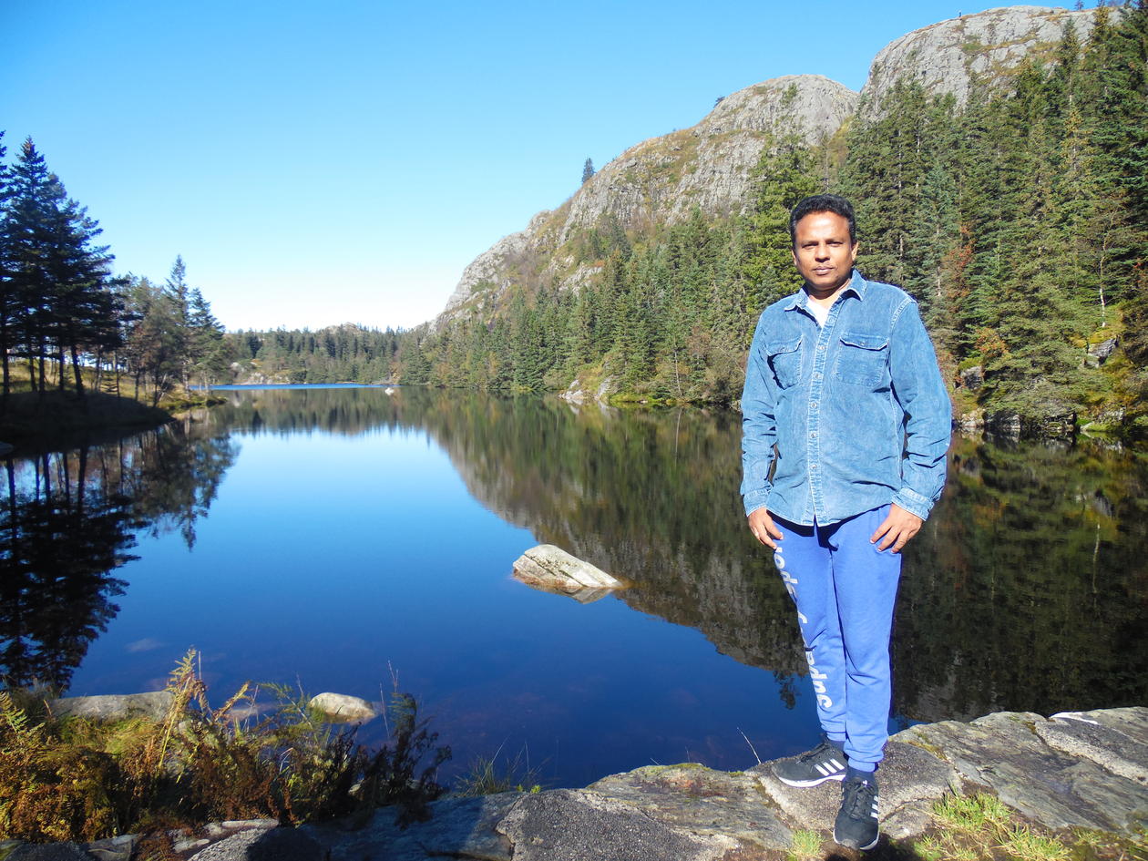 Dr Asela Perera hiking above Bergen