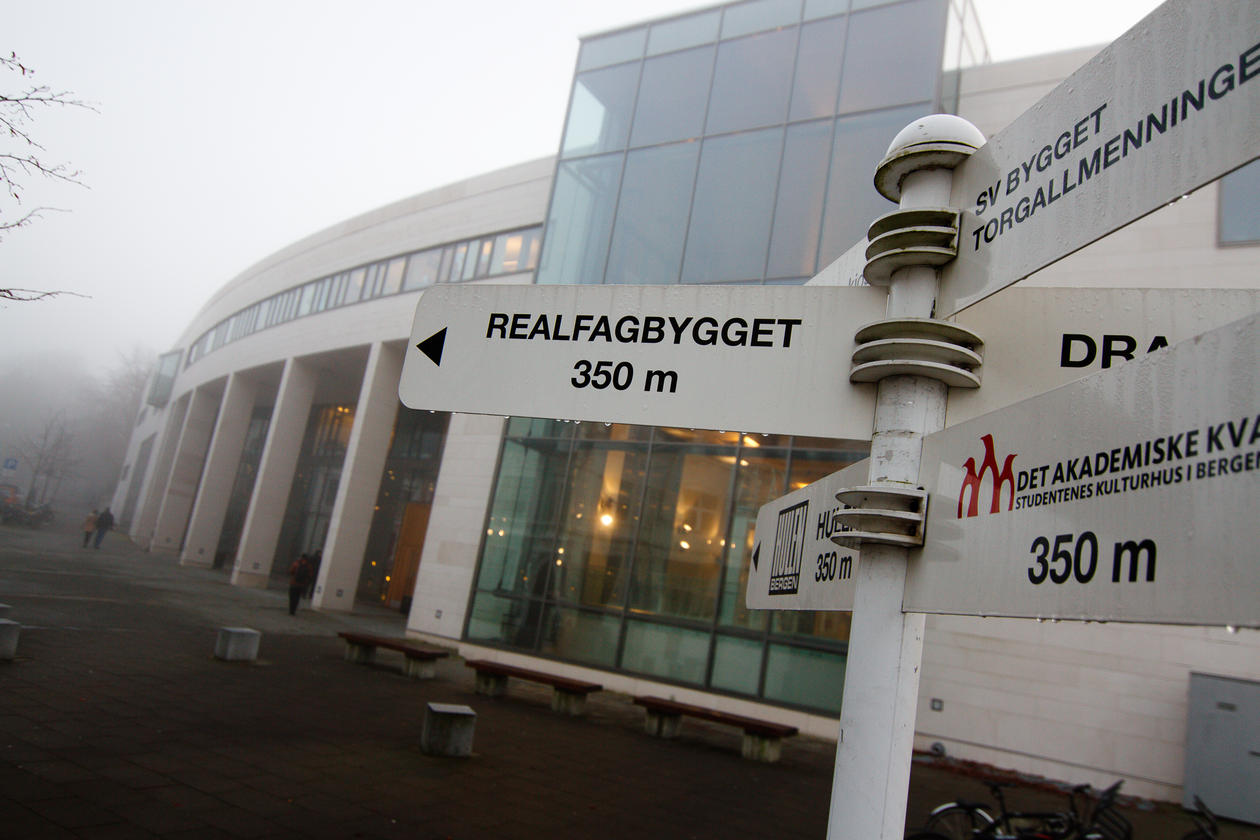 The student center in fog with a sign in front