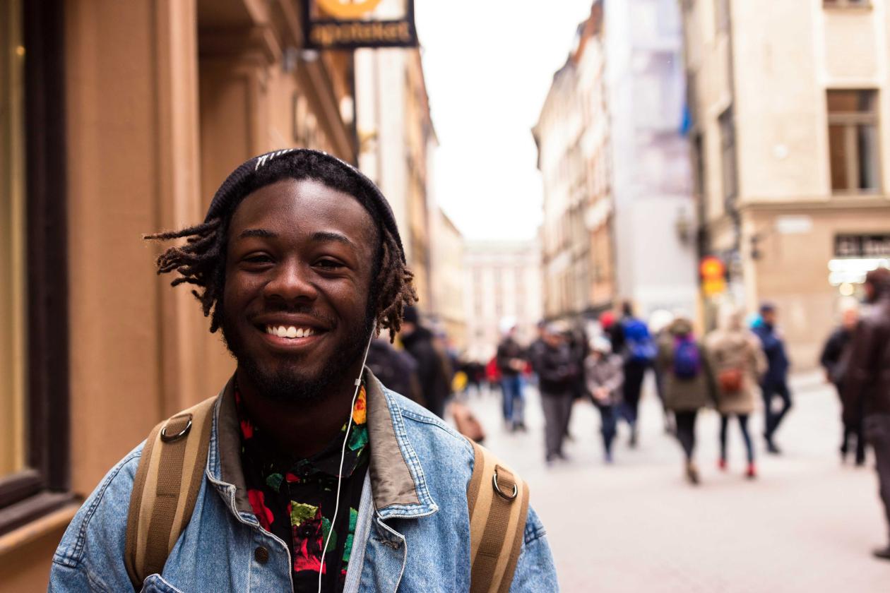 Person smiling on the street in Stockholm