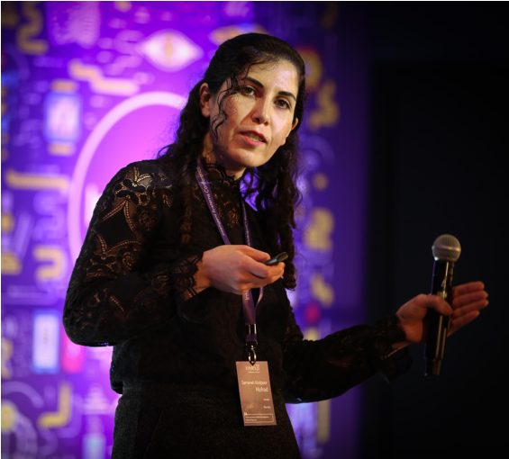 Samaneh speaking at a conference