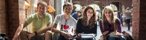 Four smiling students