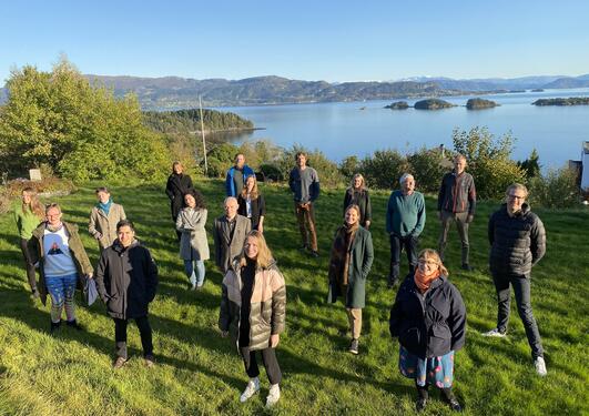 Group of people with the ocean behind them