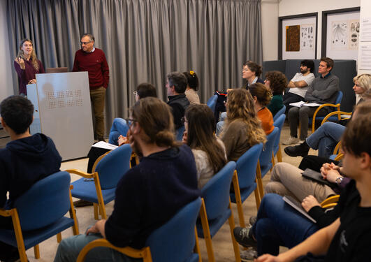 Researchers giving a presentation