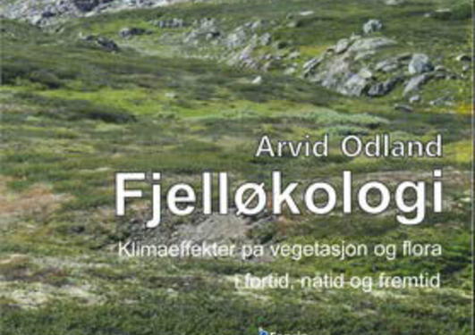 Photo of a Norwegian mountain with snow patches on the front cover of Arvid Odland's book on Fjelløkologi