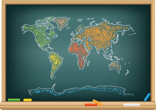 Drawing world map by a chalk on the classroom blackboard