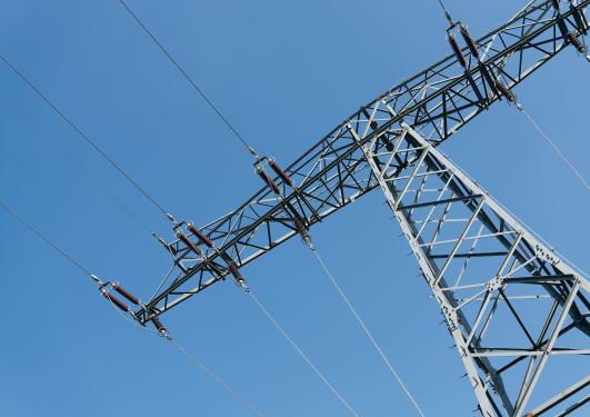 Image showing the top part of an electrical power mast against a blue skye