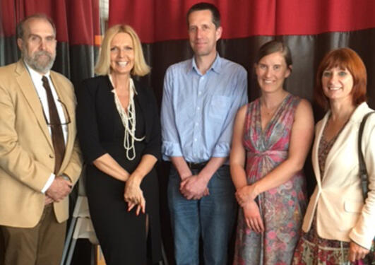 the candidate in a group photo with her supervisors and the evaluation committee.