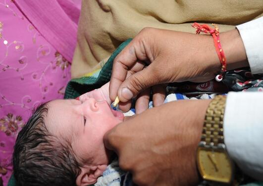 One of the babies in the Indian study receives its Vitamin A dose.