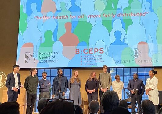 BCEPS PhD Students are standing on the stage at the opening event of BCEPS