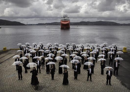 Members of the Bergen Filharmonic Orchestra with umbrellas