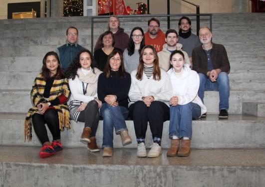 Photo of the research group sitting on the stairs in Vrimle